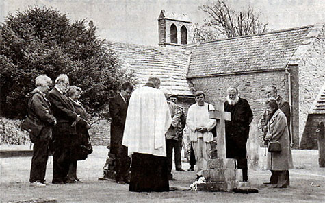 Friends and relatives at Helen Taylor's grave at St. Mary's Church, Tyneham, where in 1943, she left troops a note. Photo copyright and used with permission of Phil Yeomans BNPS Agency.