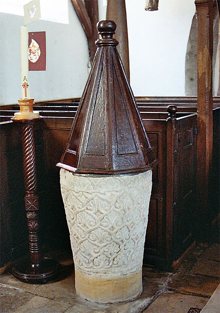The tapering tumbler shaped font at St. Mary's is decorated with interlaced stems and acanthus leafs and is 12th century. The cover, octagonal pyramid, panelled sides and finial is c.1635.