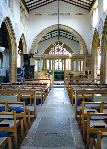 View looking down the nave to the chancel screen and the east window.