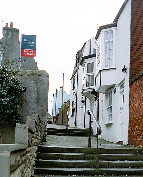 Two flights of steps help you get started on the gentle climb up Love Lane to Franchise Street.