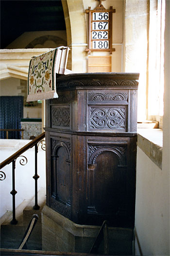 Th oak moulded and carved pulpit is probably 16th century.