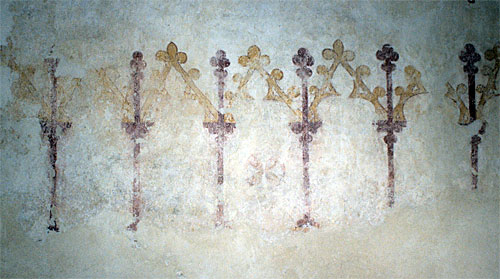 Wall painted arcading on the north wall of the nave, west of the entrance. Early 14th century.