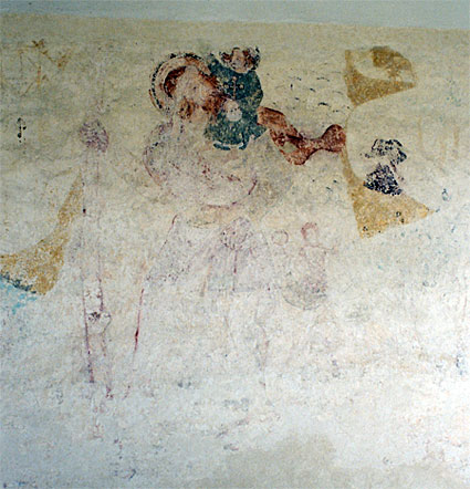 Wall painting on the north wall of the nave east of entrance. St. Christopher with a child on his shoulder and a mermaid in the background. 15th Century.