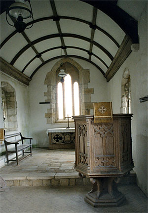 Interior from the nave looking towards the chancel. The east window is restored - originally 13th century.