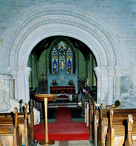 The lop-sided chancel arch. "It is the most elaborate Norman chancel arch in any Dorset parish church" says Pevsner.