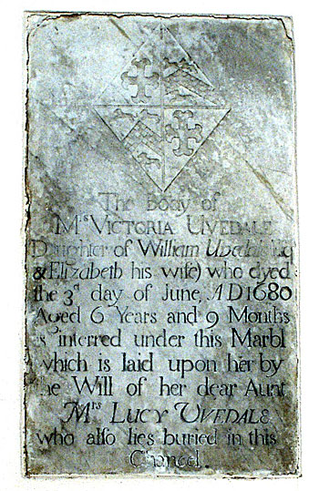 Memorial found in the north wall of the chancel.