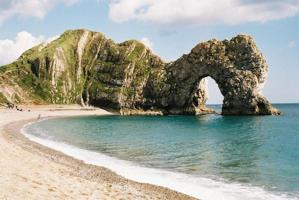 Looking like a resting dinosaur is Durdle Door on Dorset's Jurassic Coast. Photo by Chris Downer. For more information abut the photographer click on the photo.