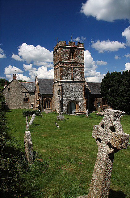 The parish church dedicated to St. Mary and the Manor House. Photo by Mike Searle. For more about the photographer please click on the image.