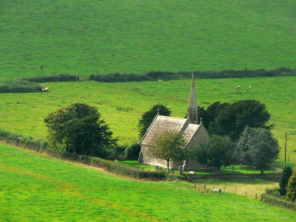 A distant view of the church at North Poorton. See our article in the North Poorton Category. Photo by Chris Downer, for more about the photographer click on the image.