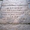 The floor slab memorial to 10-year-old James Ainsworth in St. Andrews Church.